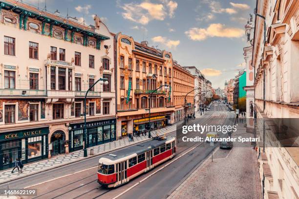 high angle view of street in prague with tram and art nouveau buildings, czech republic - prague tram stock pictures, royalty-free photos & images