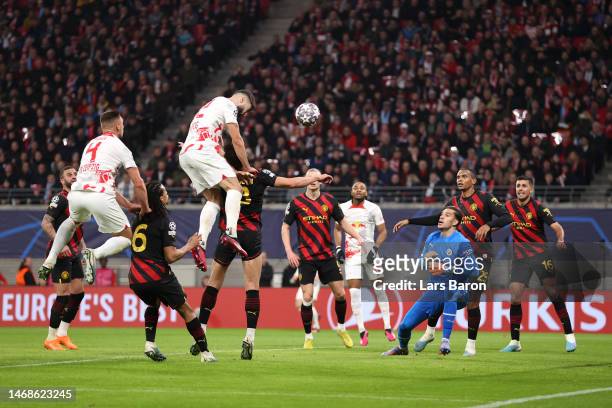 Josko Gvardiol of RB Leipzig scores the team's first goal past Ederson of Manchester City during the UEFA Champions League round of 16 leg one match...