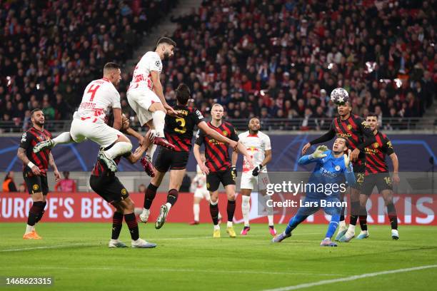 Josko Gvardiol of RB Leipzig scores the team's first goal past Ederson of Manchester City during the UEFA Champions League round of 16 leg one match...