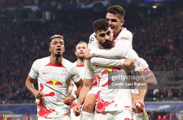 Josko Gvardiol of RB Leipzig celebrates with teammates after scoring the team's first goal during the UEFA Champions League round of 16 leg one match...