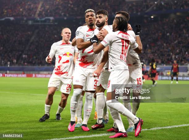 Josko Gvardiol of RB Leipzig celebrates with teammates after scoring the team's first goal during the UEFA Champions League round of 16 leg one match...