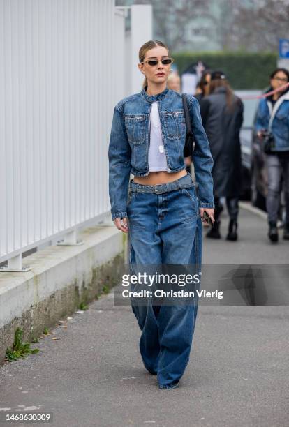Chiara Capitani is seen wearing denim jacket, cropped white top, denim jeans, black bag outside Diesel during the Milan Fashion Week Womenswear...