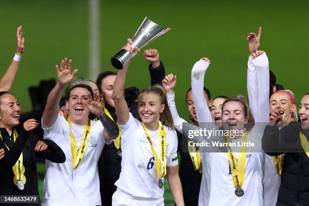 Leah Williamson of England lifts the Arnold Clark Cup following the Arnold Clark Cup match between England and Belgium at Ashton Gate on February 22,...