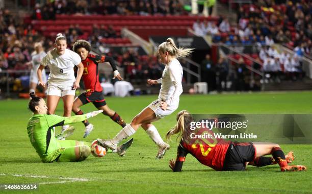 Lauren Hemp of England shoots past Nicky Evrard of Belgium during the Arnold Clark Cup match between England and Belgium at Ashton Gate on February...