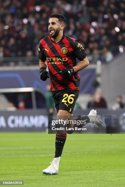 Riyad Mahrez of Manchester City celebrates after scoring the team's first goal during the UEFA Champions League round of 16 leg one match between RB...