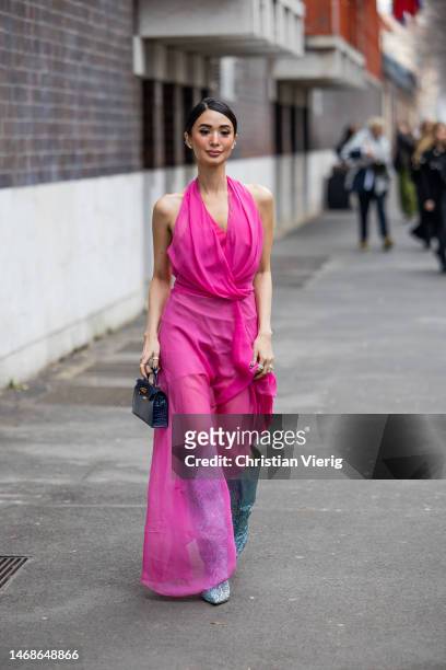 Heart Evangelista is seen wearing pink dress, Hermes bag, glitter boots outside Alberta Ferretti during the Milan Fashion Week Womenswear Fall/Winter...