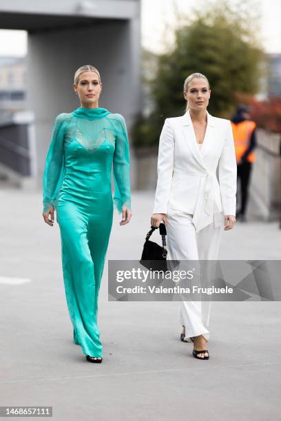 Amelia Spencer and Eliza Spencer are seen wearing a chiffon and satin mint dress with lace, and a total white look outside the Alberta Ferretti show...