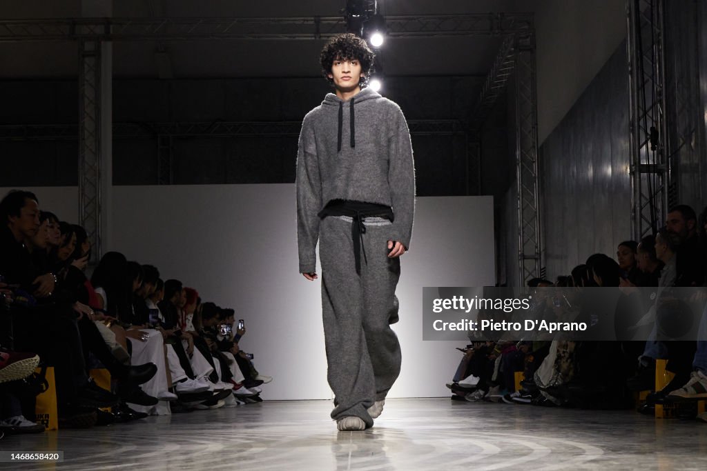 A model walks the runway at the Onitsuka Tiger fashion show during ...
