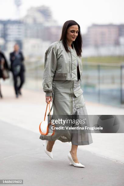 Guest is seen wearing a light green bomber jacket and cargo zipper skirt outside the Alberta Ferretti show during the Milan Fashion Week Womenswear...