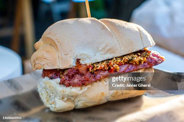 choripán with chimi churri. chorizo sandwich. traditional argentine food. - griddle stock pictures, royalty-free photos & images