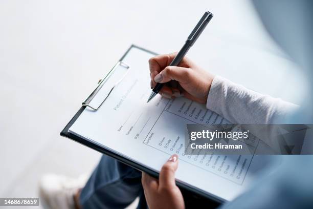 hands, documents and writing with a woman in a hospital, filling out an application or questionnaire for healthcare overhead. medical, checklist and paperwork with a person filing an insurance report - checklist stockfoto's en -beelden