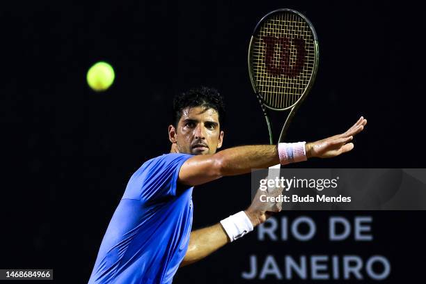 Thomaz Bellucci of Brazil returns a shot to Sebastian Baez of Argentina during day three of ATP 500 Rio Open presented by Claro at Jockey Club...