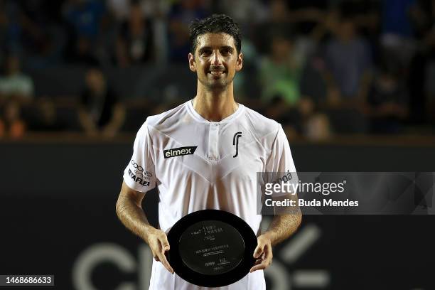 Thomaz Bellucci of Brazil receives a tribute for his retirement from tennis during a match against Sebastian Baez of Argentina during day three of...