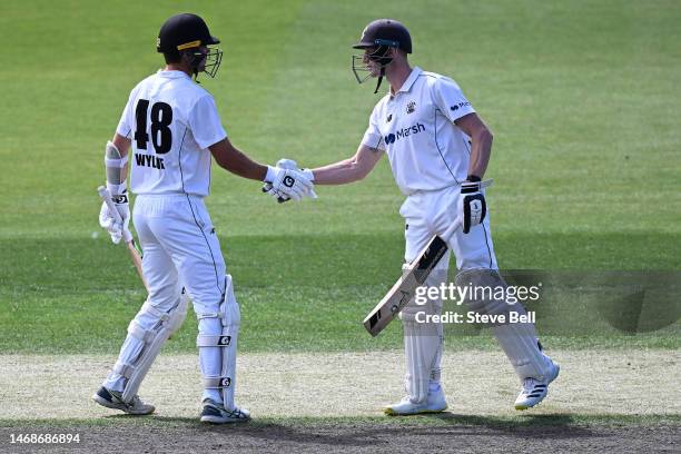 Teague Wyllie of Western Australia is congratulated by Cameron Bancroft of Western Australia on scoring a half century during the Sheffield Shield...