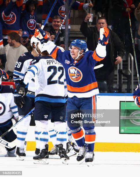 Bo Horvat of the New York Islanders celebrates a third period goal by Simon Holmstrom against the Winnipeg Jets at the UBS Arena on February 22, 2023...