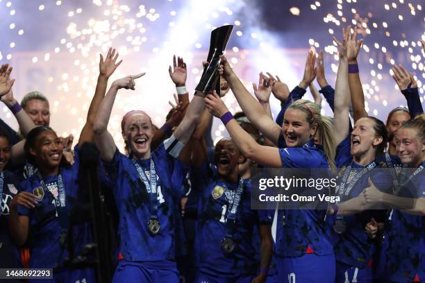 Becky Sauerbrunn and Lindsey Horan of United States lift the trophy to celebrate after winning the 2023 SheBelieves Cup Final against Brazil at...