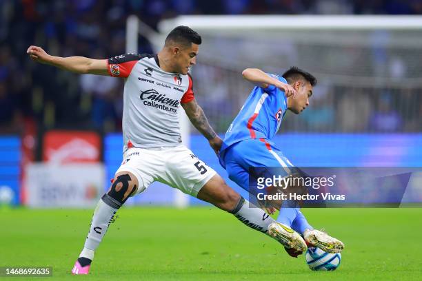 Anderson Santamaria of Atlas battles for possession with Carlos Rodriguez of Cruz Azul during the 7th round match between Cruz Azul and Atlas as part...