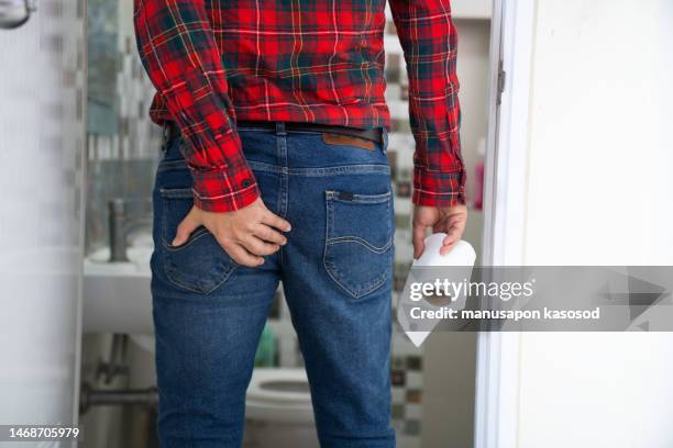 stomach ache man, diarrhea,going to the toilet - men taking a dump stockfoto's en -beelden