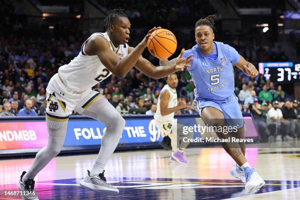 Ven-Allen Lubin of the Notre Dame Fighting Irish and Armando Bacot of the North Carolina Tar Heels battle for a rebound during the second half at...