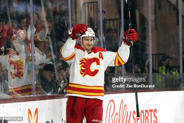 Mikael Backlund of the Calgary Flames celebrates after scoring a goal in the third period at Mullett Arena on February 22, 2023 in Tempe, Arizona.