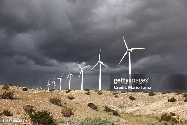 Wind turbines operate at a wind farm, a key power source for the Coachella Valley, on February 22, 2023 near Whitewater, California. Wind turbines in...