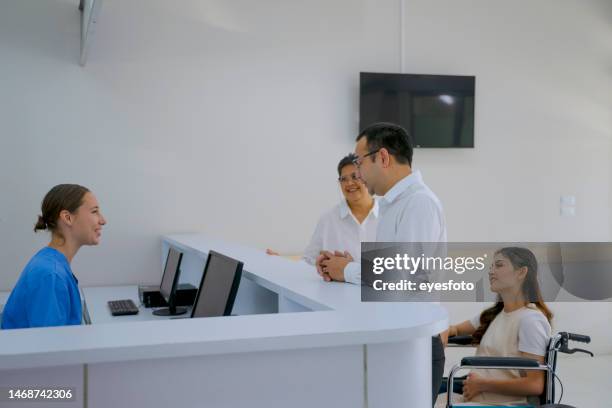 multi-generation family go to hospital. - hospital reception stock pictures, royalty-free photos & images