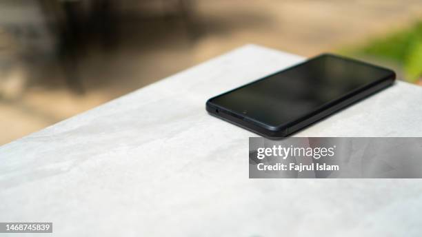 mobile phone on white table - flower pot overhead stock pictures, royalty-free photos & images