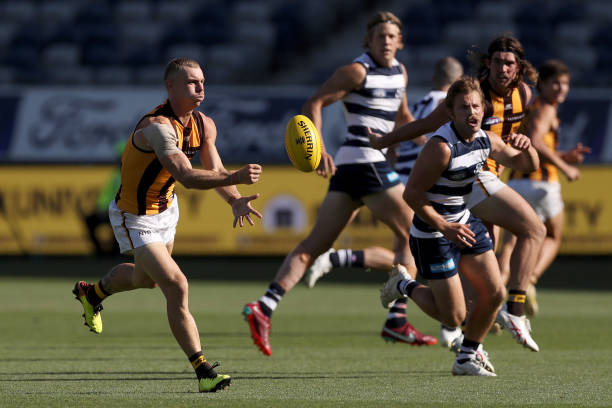 James Worpel of the Hawks handballs during the AFL Match Simulation between Geelong Cats and Hawthorn Hawks at GMHBA Stadium on February 23, 2023 in...