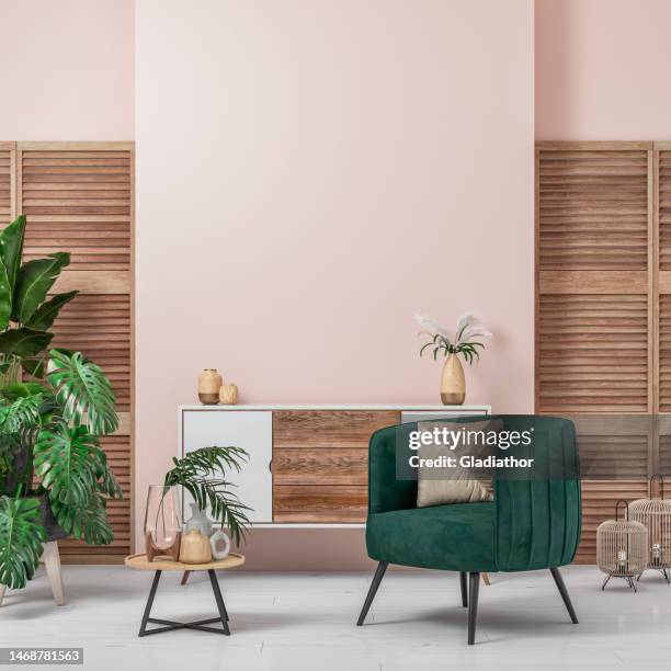 cozy retro-chic interior with an art deco armchair, cabinet and potted plants, 50s- 60s decoration - modern art interior stockfoto's en -beelden