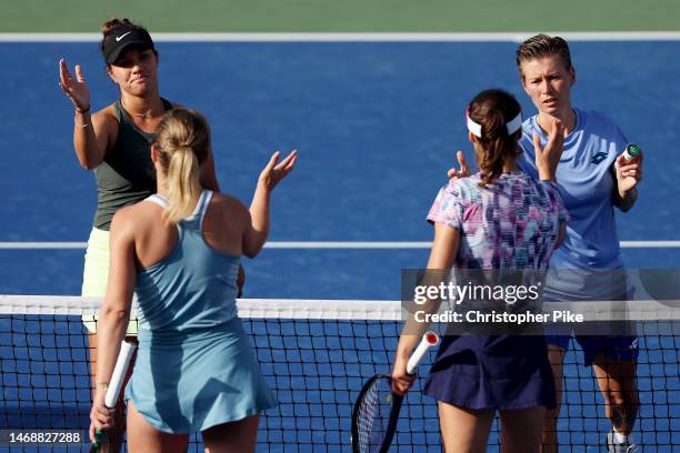 Desirae Krawczyk of the USA and Demi Schuurs Netherlands shake hands after defeating Monica Niculescu of Romania and Kimberley Zimmermann Belgium...