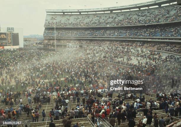 Mets fans rush onto the field after the New York Mets' beat the Cincinnati Reds to win the National League title at Shea Stadium in September 1973.