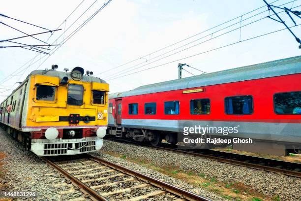 two trains overtaking - india train stock-fotos und bilder
