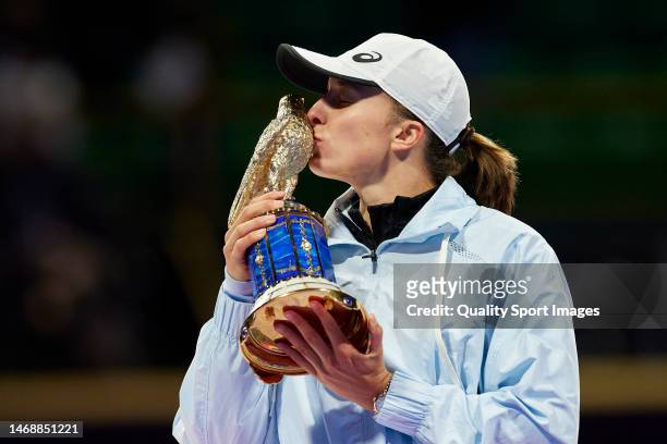 Iga Swiatek of Poland celebrates with the trophy after winning against Jessica Pegula of the United States during the Women’s Singles final match on...