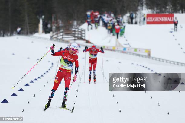Gold medalist Johannes Hoesflot Klaebo of Norway celebrates as he approaches the finish line to win the Cross-Country Women's Sprint Final Classic at...