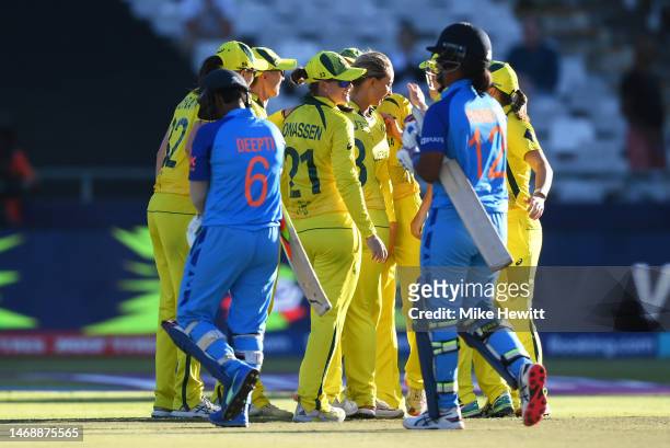 Players of Australia celebrate following the ICC Women's T20 World Cup Semi Final match between Australia and India at Newlands Stadium on February...