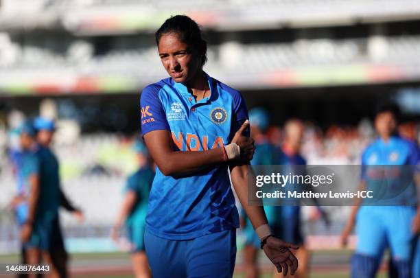 Harmanpreet Kaur of India cuts a dejected figure following the ICC Women's T20 World Cup Semi Final match between Australia and India at Newlands...