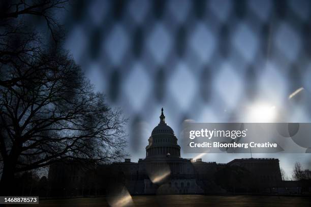 security fence outside the u.s. capitol building - capitol hill winter stock pictures, royalty-free photos & images