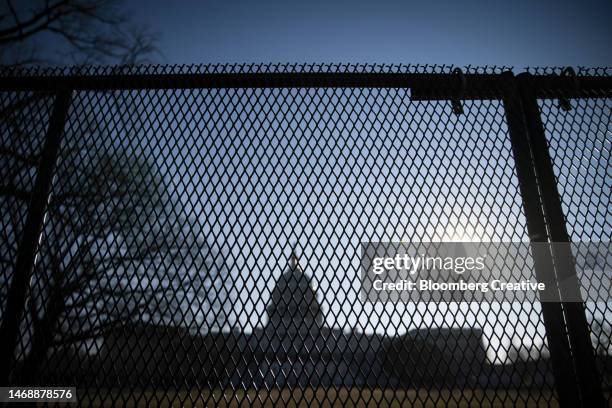 security fence outside the u.s. capitol building - capitol hill winter stock pictures, royalty-free photos & images