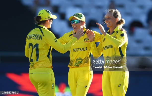 Jess Jonassen, Meg Lanning and Ashleigh Gardner of Australia celebrate following the ICC Women's T20 World Cup Semi Final match between Australia and...