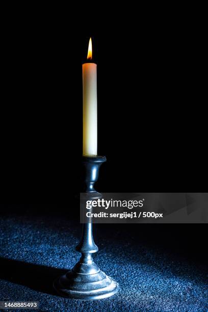 close-up of illuminated candle on table,canterbury,united kingdom,uk - menorah lights stock pictures, royalty-free photos & images