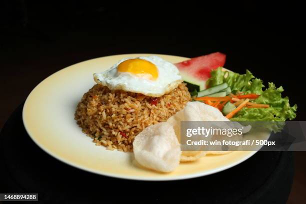 close-up of food in plate against black background - fotografi ストックフォトと画像