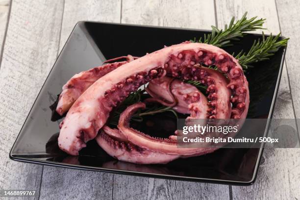 high angle view of meat in plate on table,vaslui,romania - octopus ink stock pictures, royalty-free photos & images
