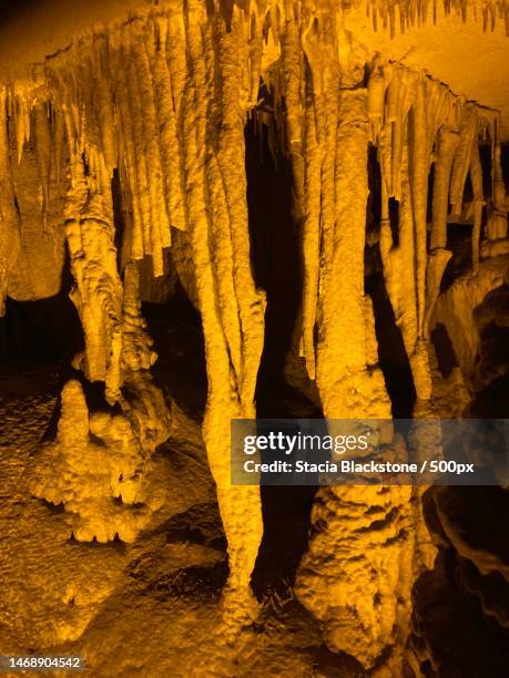 low angle view of rock formation - tropfsteinhöhle stalaktiten stock-fotos und bilder