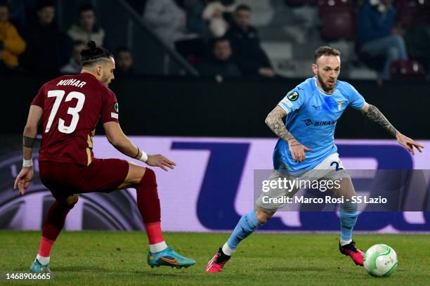 Manuel Lazzari of SS Lazio compete for the ball wirh Karlo Muhar of CFR Cluj during the UEFA Europa Conference League knockout round play-off leg two...