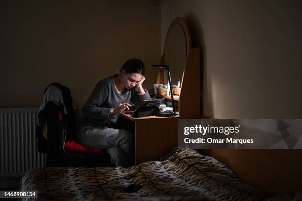 Juliana, age 14 from Dnipro Oblast attends A Ukrainian online class at the Green Hotel on February 23, 2023 in Jerzmanowice, Poland. The Green Hotel...