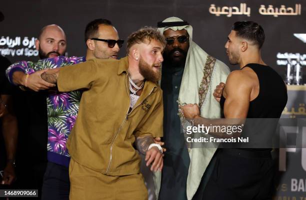 Jake Paul and Tommy Fury clash during the Jake Paul v Tommy Fury Press Conference on February 23, 2023 in Riyadh, Saudi Arabia.
