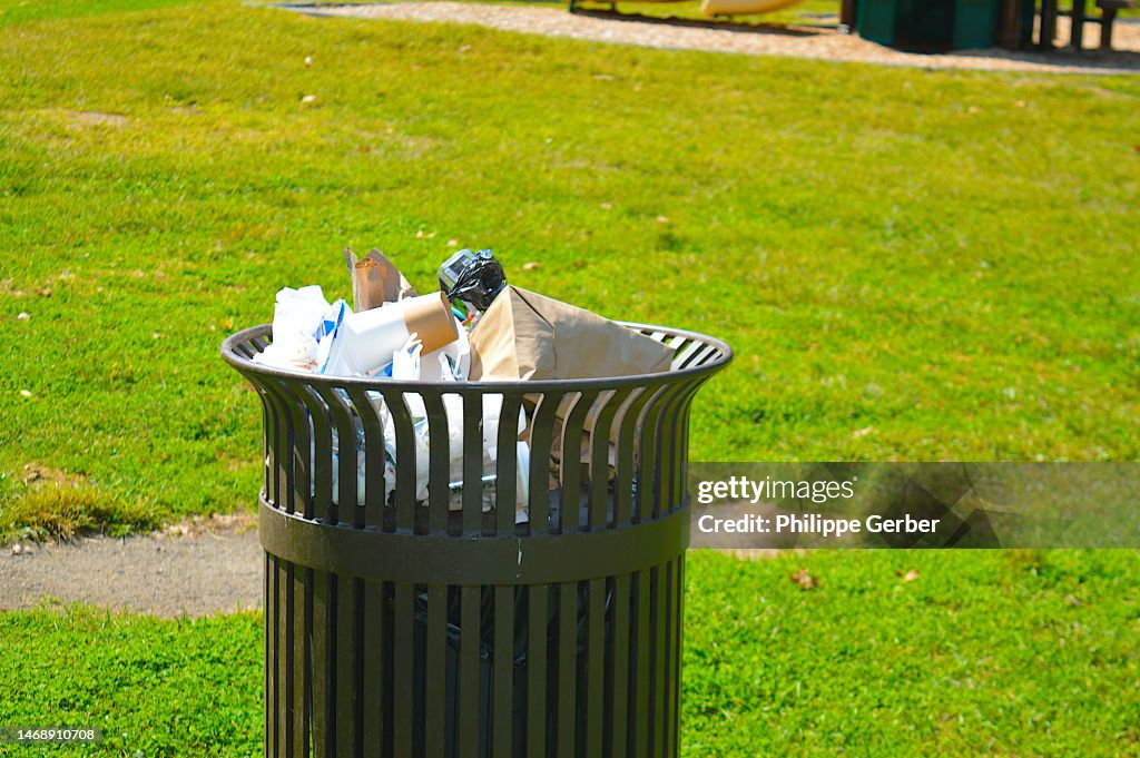 Overflowing Trash Bin In Public Park High-Res Stock Photo - Getty Images