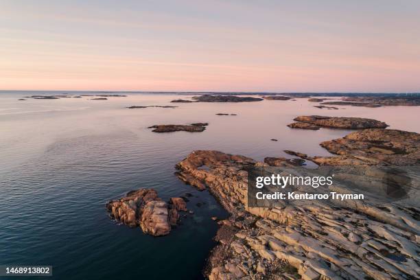 aerial view of archipelago environment with rocks and sea, at sunset. - archipelago stock pictures, royalty-free photos & images