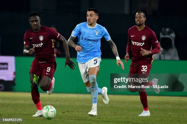 Matias Vecino of SS Lazio competes for the ball wirh Cephas Malele of CFR Cluj during the UEFA Europa Conference League knockout round play-off leg...