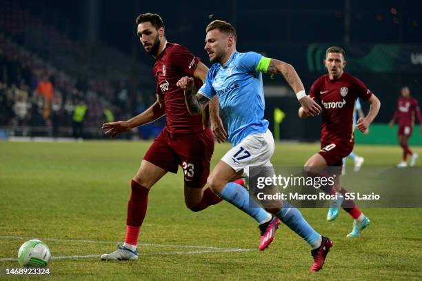 Ciro Immobile of SS Lazio competes for the ball wirh Denis Kolinger of CFR Cluj during the UEFA Europa Conference League knockout round play-off leg...